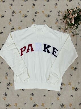 Parker Cream Pullover with Dark Teal Logo Tag